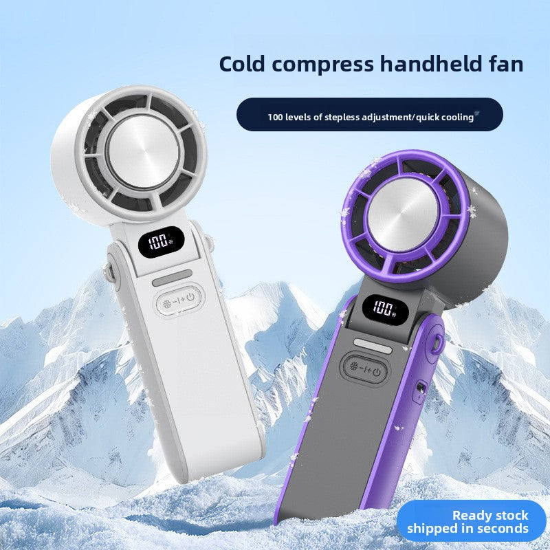 Cold compress handheld fans with digital displays against a snowy mountain background